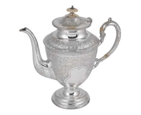 A VICTORIAN SILVER COFFEE POT, COOPER BROTHERS, SHEFFIELD, 1897 the urn-shaped body with shaped panels of scrolling foliate b