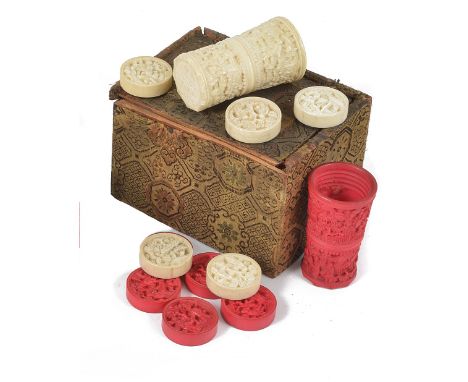 A SET OF CHINESE IVORY BACKGAMMON COUNTERS AND DICE CUPS, PROBABLY CANTON, CIRCA 1900 the sixteen red stained and sixteen nat