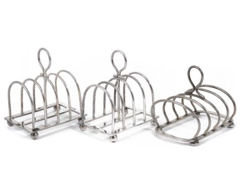 A PAIR OF GEORGE V SILVER TOAST RACKS, WILLIAM HUTTON & SONS LTD., SHEFFIELD, 1931 each of five arched bars and central loop 