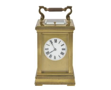 A FRENCH GILT BRASS CARRIAGE CLOCK, LATE 19TH CENTURY gong striking hour repeating movement, circular white enamel dial set b