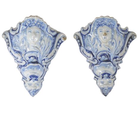 A pair of blue and white English Delftware earthenware wall pockets, probably Liverpool, MID 18TH CENTURY each modelled with 