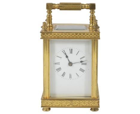 A FRENCH GILT-BRASS CARRIAGE CLOCK, LATE 19TH CENTURY gong striking movement, white dial with Roman numerals, case with flute