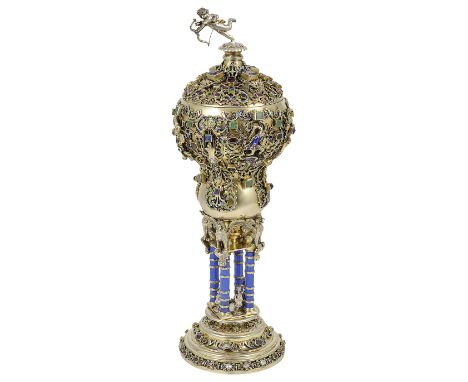 AN AUSTRIAN GEM-SET AND ENAMEL SILVER-GILT STANDING CUP AND COVER, UNMARKED, LATE 19TH CENTURY blue-enamelled four-column ste