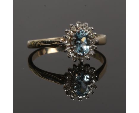 A gold aquamarine and diamond cluster ring (tested gold) size O.