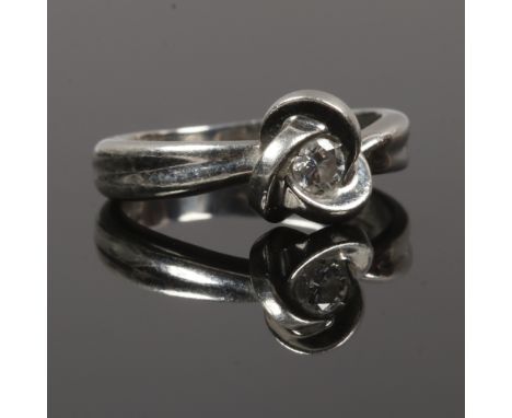 A platinum and diamond ring, size I.