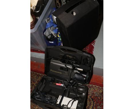 A cased Panasonic VHS video recorder model number VW-SHM20, bag of associated accessories and a projector.