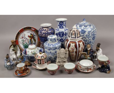 A collection of oriental ceramics to include blue and white, ginger jar, clay figures etc.