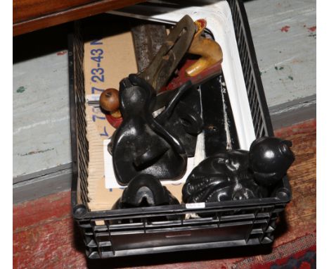 A box of metalwares, cast iron ball and claw bath feet, acorn smoothing plain, log splitters, hinges and shelf brackets.
