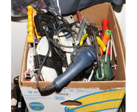 A box of various tools tape measures, G clamps, bolt cutters, scrappers and drills.