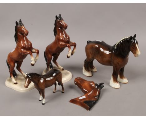 Five ceramic figures of horses two by Beswick.Condition report intended as a guide only.Chipped ear to one.