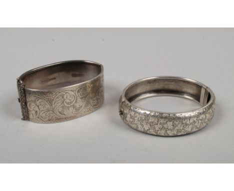 A silver bangle assayed Birmingham 1948 along with another similar.