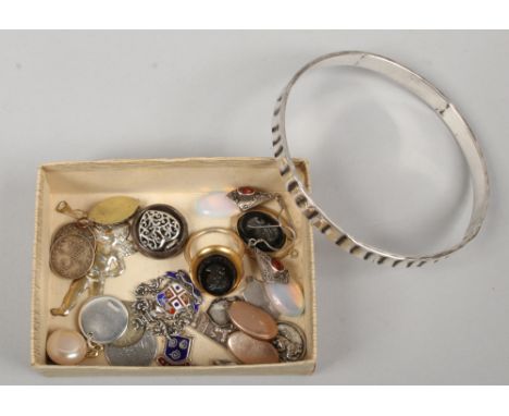 A quantity of silver jewellery including drop earrings set with opalescent stones, a bangle, fobs, locket etc.