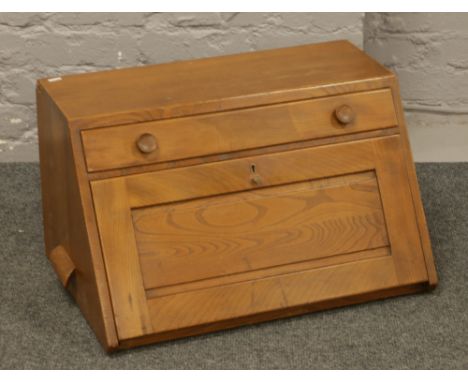An Ercol table top bureau.