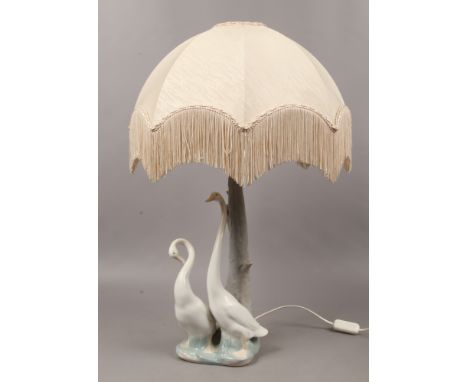 A large Nao table lamp surmounted with a pair of geese.