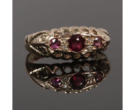 A 9ct gold, ruby and diamond seven stone ring, assayed Chester 1912, size L.