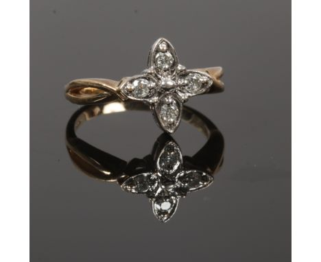 A 9ct gold and four stone diamond ring in open cluster setting, size N.