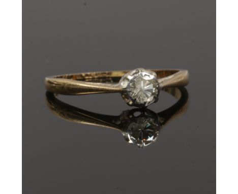 A 9ct gold and platinum solitaire diamond engagement ring. Set with a brilliant cut diamond approximately 0.2ct, size L