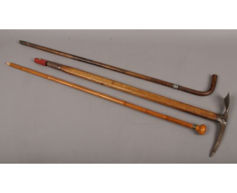 An early 20th century Austrian walking ice axe maker Stubai, a walking stick with silver collar and a bamboo walking cane.Con