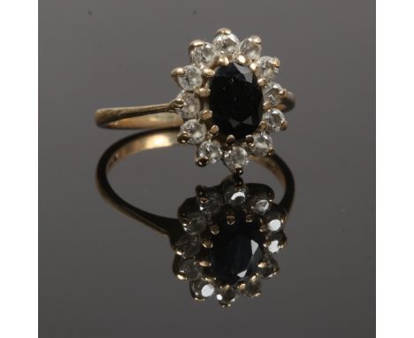 A 9ct gold sapphire and diamond halo cluster ring, size L.