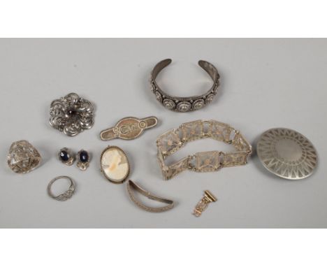 A quantity of silver and white metal jewellery including a Danish pewter brooch, Indian bangle, brooches etc.
