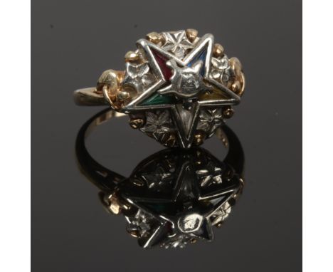 A gold ring with star motif made up of triangular cut coloured gem stones stamped 10k size Q1/2.
