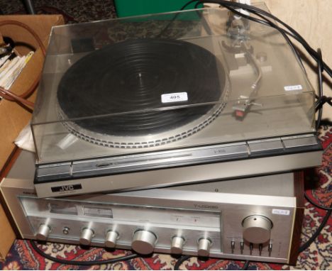 A Nikko NR - 819 stereo amplifier, along with a JVC L- A55 turn table.