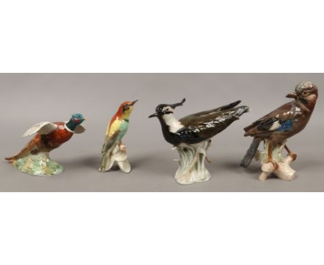 Four ceramic birds to include Beswick pheasant, Goebel models of jays, common linnet etc.