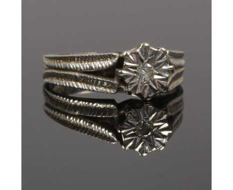 An 18ct white gold solitaire diamond ring, size J.