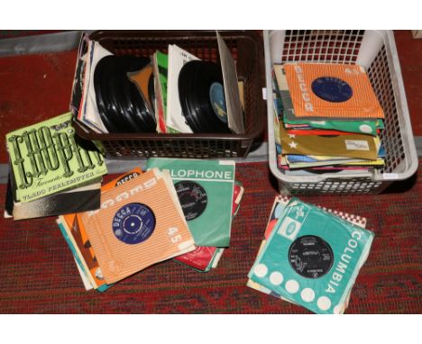 Two boxes of single records to include Rolling Stones, Shirley Bassey, ABBA, Elton John etc.