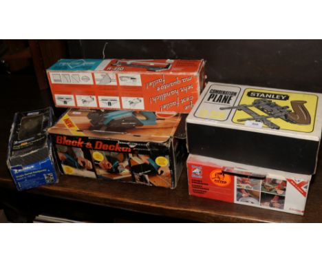 A collection of boxed tools Black and Decker electric planer, Stanley combination planer, tile slicer, record handy engraver 