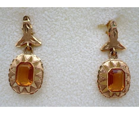 A pair of vintage 18ct gold and citrine lever backed drop earrings. Floral design to posts, square shaped drop mount with sun