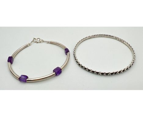 2 silver bracelets. A vintage patterned bangle hallmarked Birmingham 1938 and a modern bracelet with spring ring clasp made f