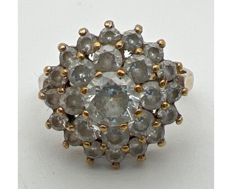 A 9ct gold and cubic zirconia large cluster ring. Central round cut stone surrounded by 2 rows of smaller round cut stones. F