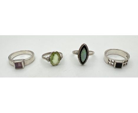 4 silver stone set dress rings to include amethyst, Onyx and mother of pearl. Sizes K, M and N. 