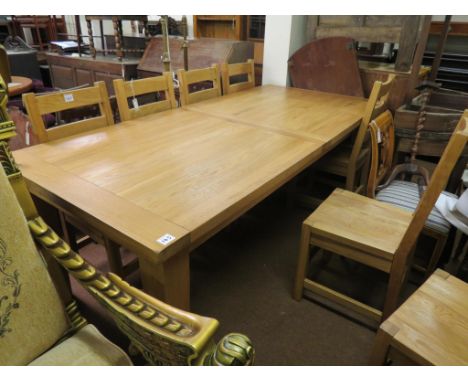 A good quality modern, solid, light oak dining set, table with plank top and cleated ends, concealed extra leaf, 7ft. 1in. op