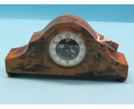 An early 20th century tortoiseshell-effect mantel clock, circular, convex, painted dial, French movement with integral key, 1