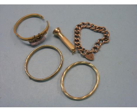 Two 9ct. gold bangles, a 9ct. gold-link bracelet with padlock clasp, 44.3 grams total, together with an engine-turned 14ct. g