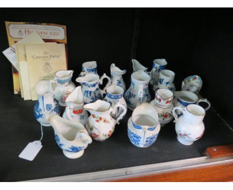 Eighteen reproduction Royal Worcester cream jugs, variety of 18th century designs painted in underglaze blue and enamels