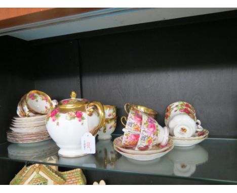 A Royal Chelsea bone china part teaset, Golden Rose pattern, twenty pieces including teapot and four other similar cups and s