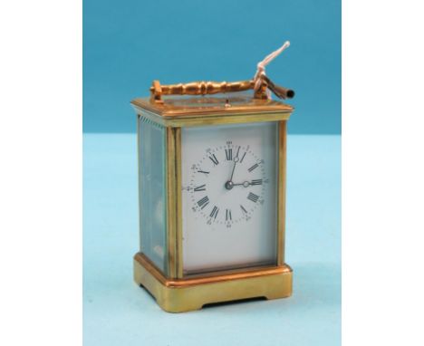An early 20th century French brass repeating carriage clock, with enamelled dial and gong-striking movement, unsigned, in obi