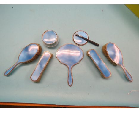 A silver and translucent blue enamel dressing table set, seven pieces, some damage