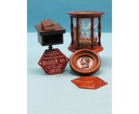 An unusual three-sand glass timer, turned mahogany with inset monogram plaques, durations of 3, 4, and 5 minutes, 5.5in., two