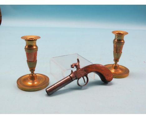 A small, 19th century percussion pistol, with engraved lock and walnut stock, 7in., together with a pair of Soutterware brass