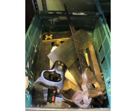 A crate containing vintage planes, saws, etc.
