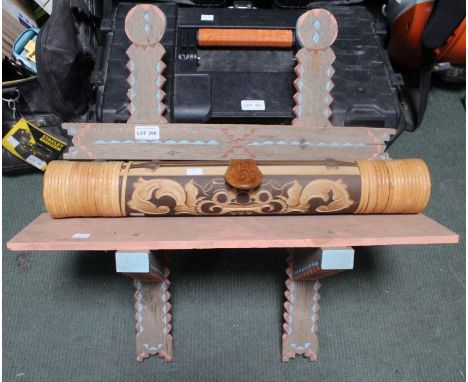 A possible Polynesian hanging wooden shelf, together with a wooden percussion instrument