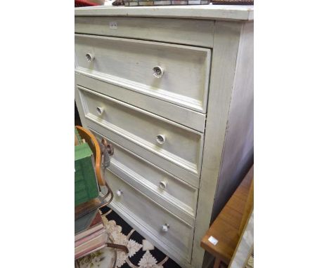 A painted softwood four drawer chest with blue and white ceramic handles