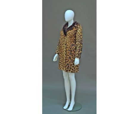 A leopard skin coat (panthera pardus) purchased before 1944, with mink collar and front slit pockets, approx UK size 12, toge