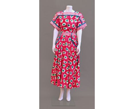 A 1950s style pink floral print dress by Jeanne Marc, with button detailing to the yoke and shoulders, front patch pockets an