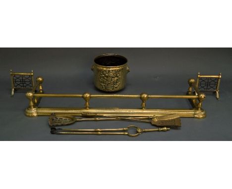 A brass rectangular fender, late 19th/early 20th century, 135cm wide, together with a cylindrical coal bucket, decorated with