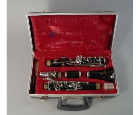 A Boosey and Co. Limited clarinet, 65cm long, in a leather case
